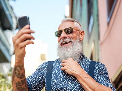 Happy man looking at phone