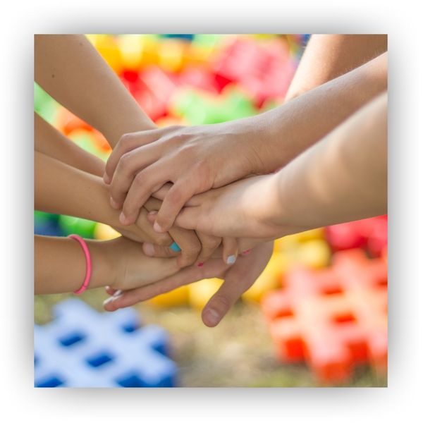 Stacking hands in a classroom