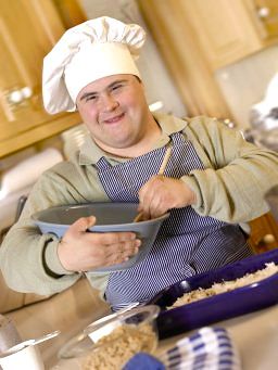 Boy with Down Syndrome cooking