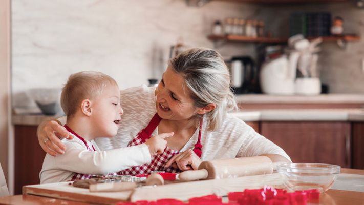 mom smiling with her son in the kitchen