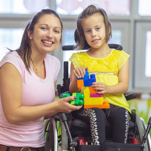 caregiver and child smiling
