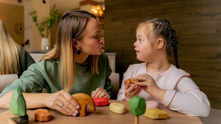 woman teaching a child