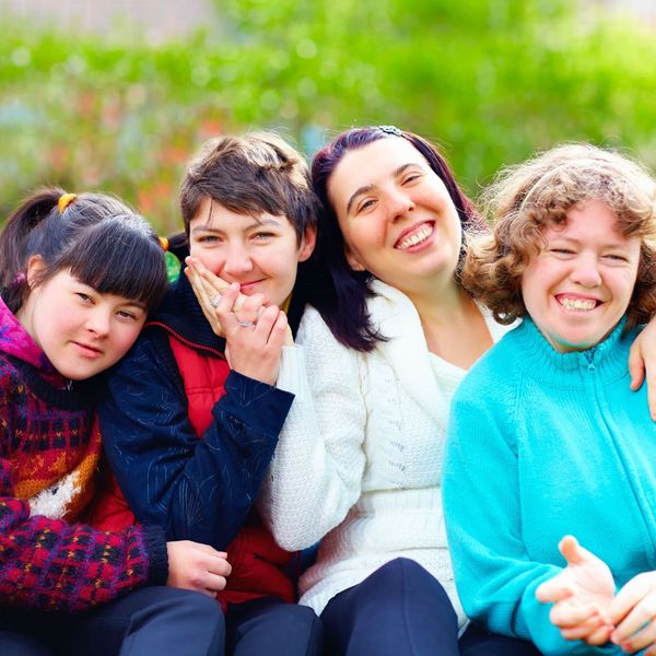 4 women smiling for a picture