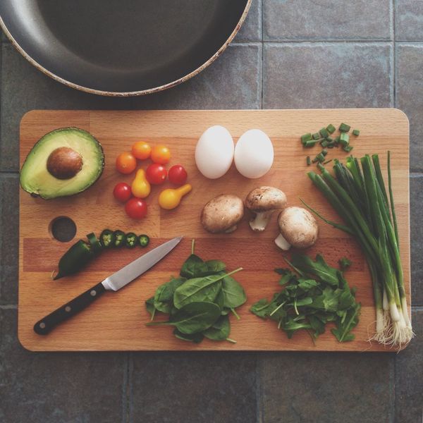 cutting board with veggies on it