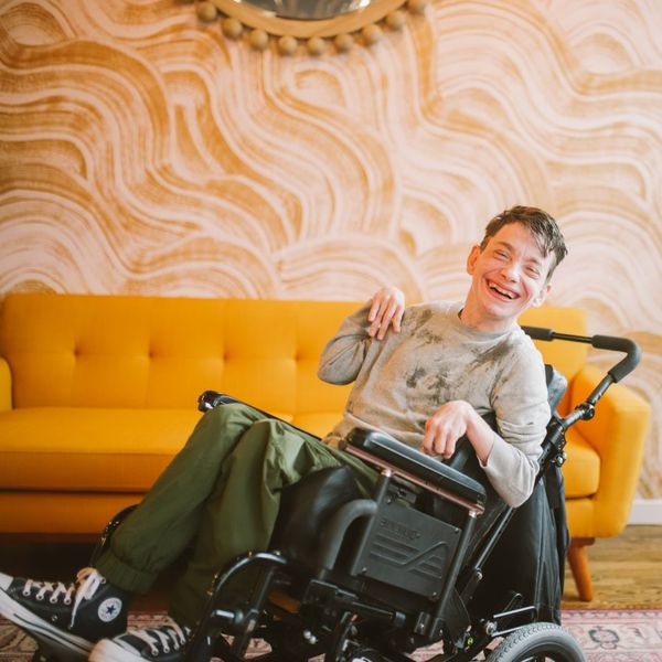 smiling man in a wheelchair