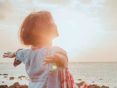 A woman feeling better about herself after meditating