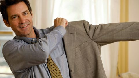 Man getting dressed in suit
