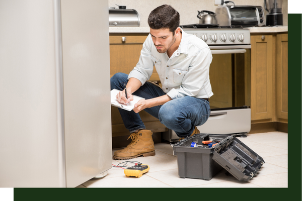 A tech inspecting a dishwasher