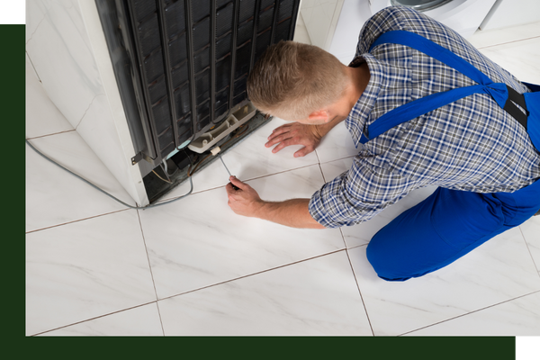 technician diagnosing freezer issues