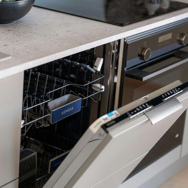 open dishwasher with a faulty drain