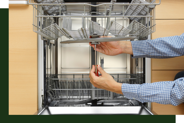 A dishwasher being fixed