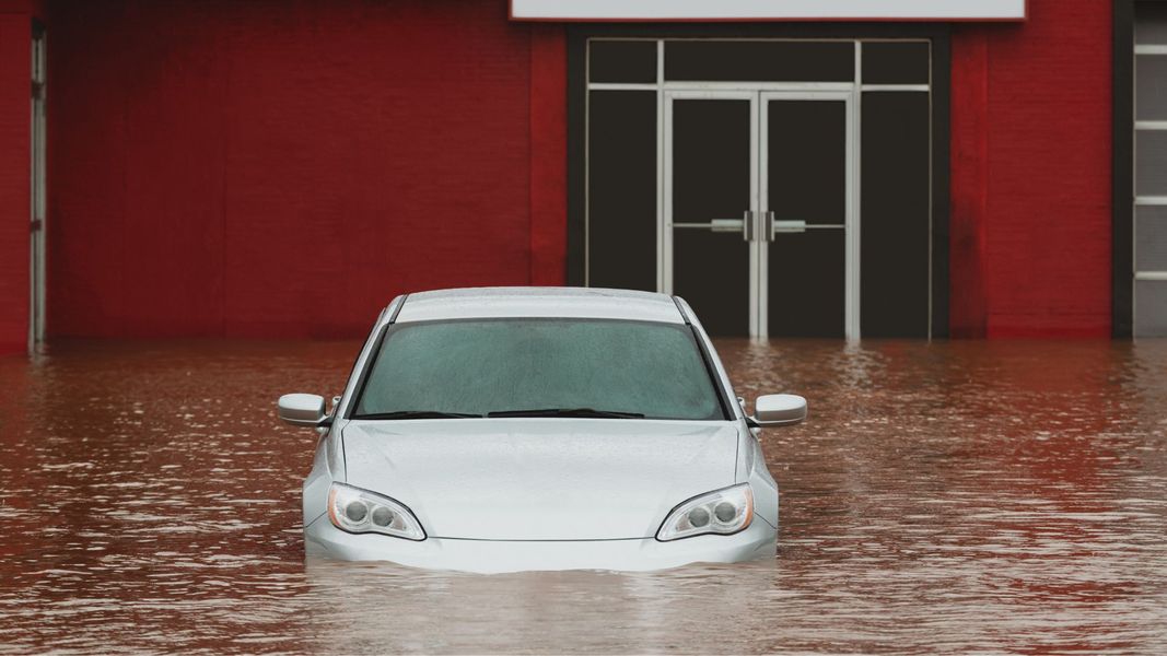 car in flooded parking lot