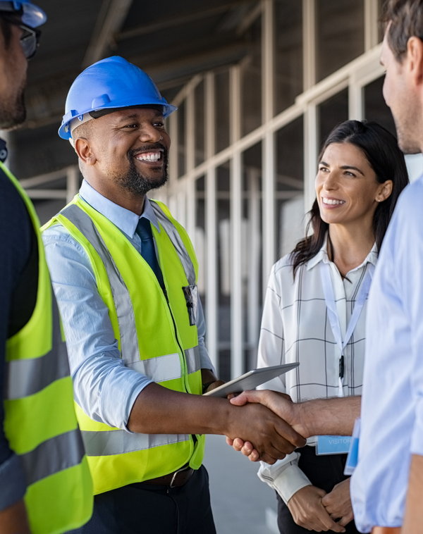 An engineer speaking with building managers