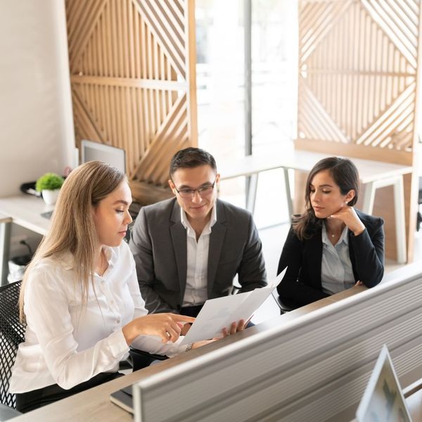 A lawyer meeting with a couple business executives