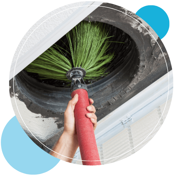 Person cleaning air duct with a brush tool