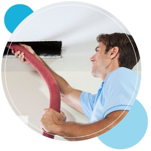 man cleaning residential air duct