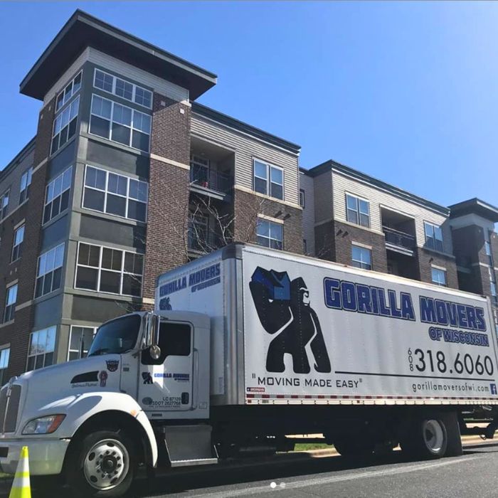Gorilla Movers moving truck outside apartment building