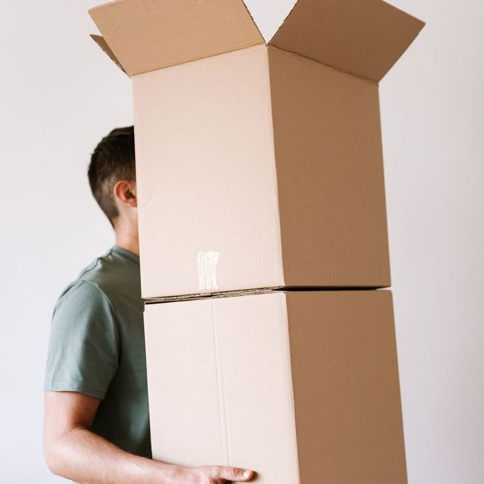 person carrying moving boxes 