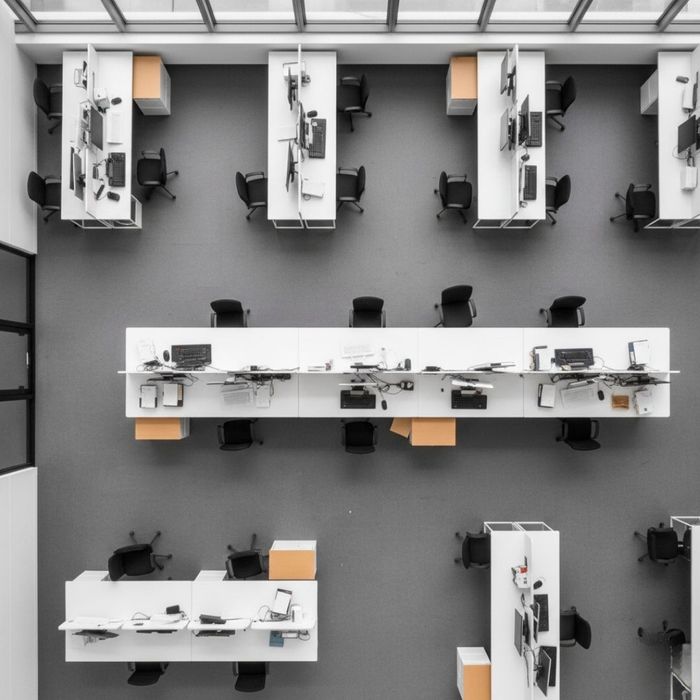 Overhead shot of an organized office space with empty desks, ready for a weekend move