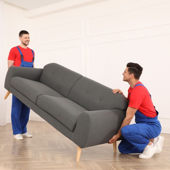 movers lifting a couch