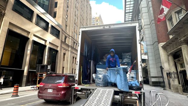person loading moving truck