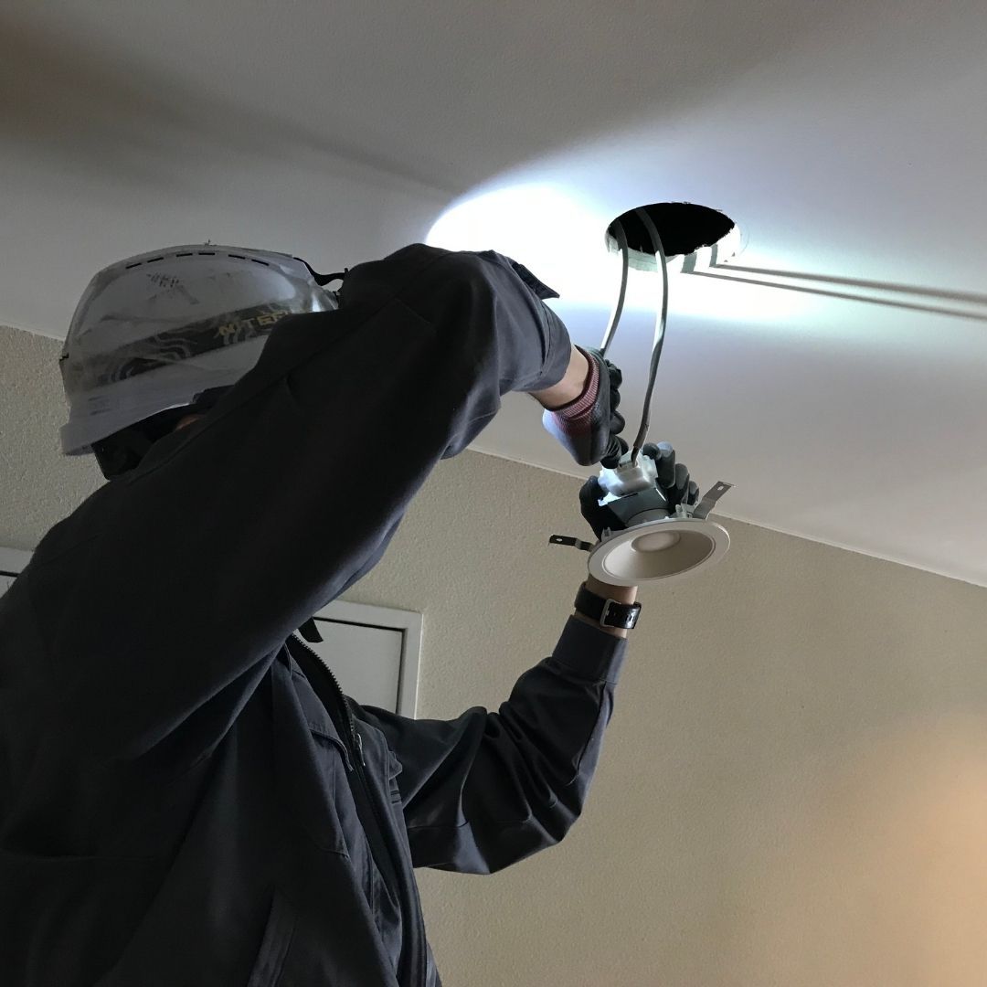 electrician installing lighting