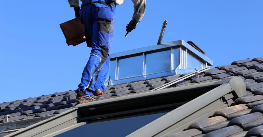 Man Working On Roof 