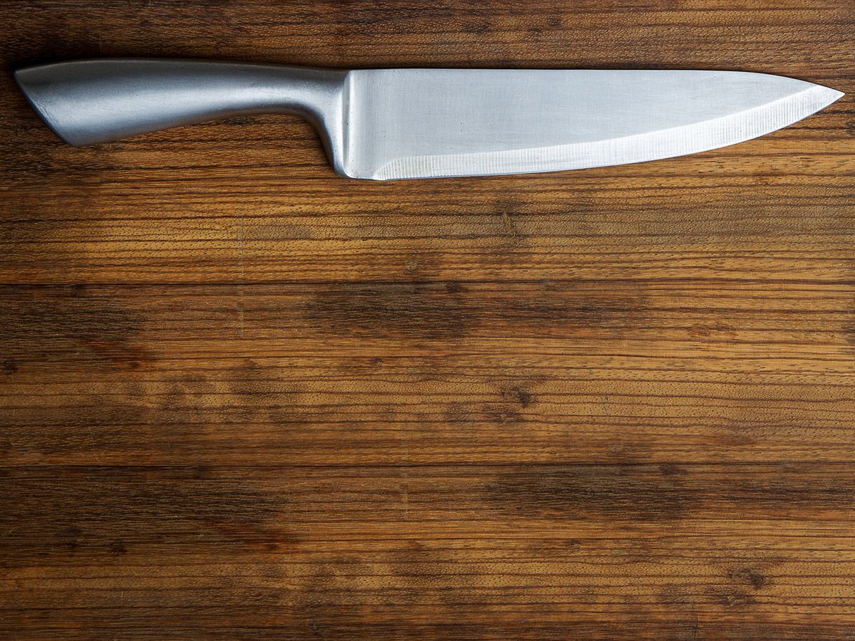 An image of a knife on a cutting board.