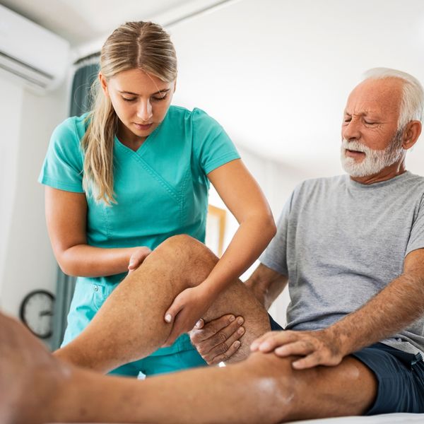 Man getting his knee treated