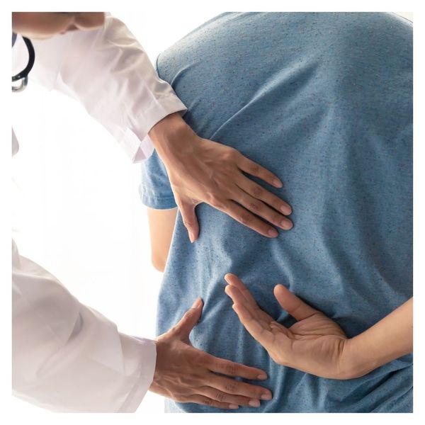 chiropractor looking at person's back