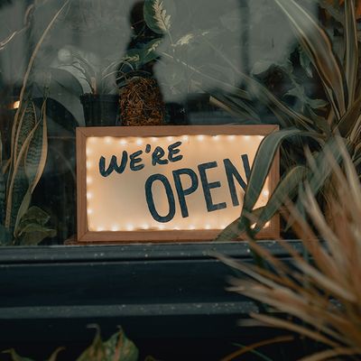 An open sign in a local business's window