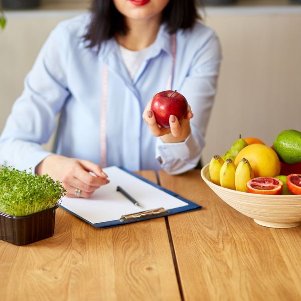 Dietitian holding an apple