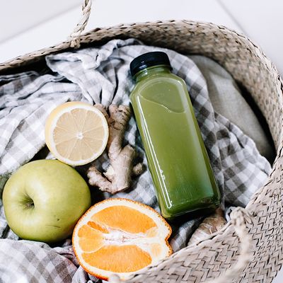 A healthy drink and fruit in a basket