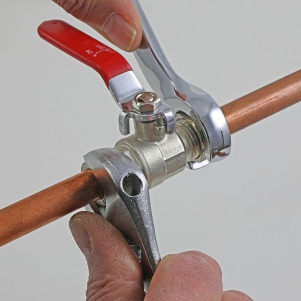 using wrenches to tighten copper fittings