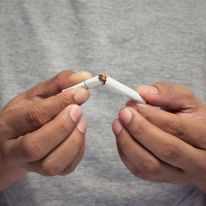 Man holding cigarettes. Man holding cigarettes.