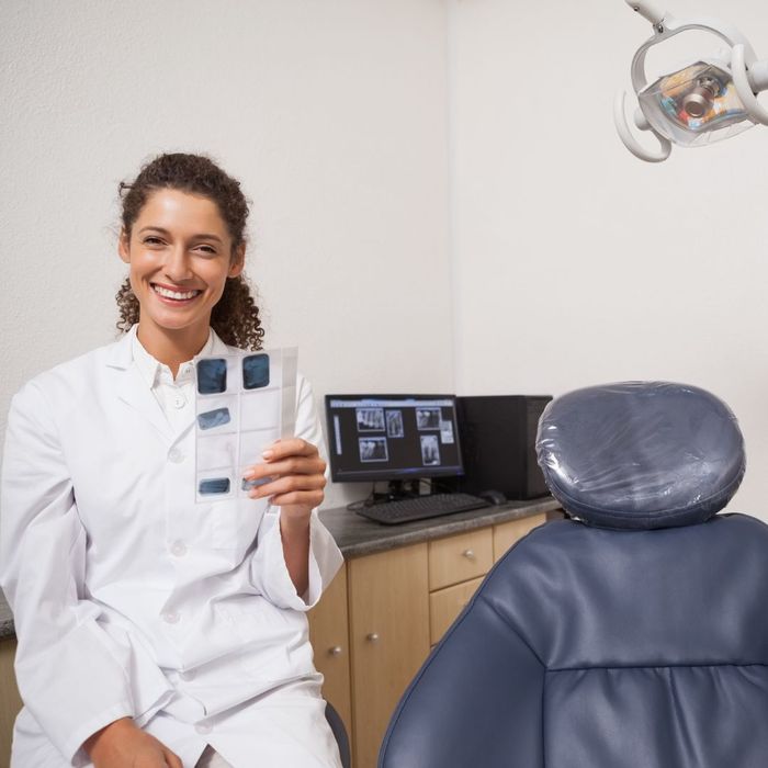 dentists holds xrays in exam room Common Misconceptions About Dental Care Debunked 4.jpg