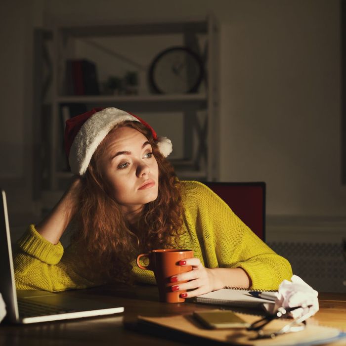 woman leans on table while staring off in distance How Does Stress Influence Gum Disease 1.jpg