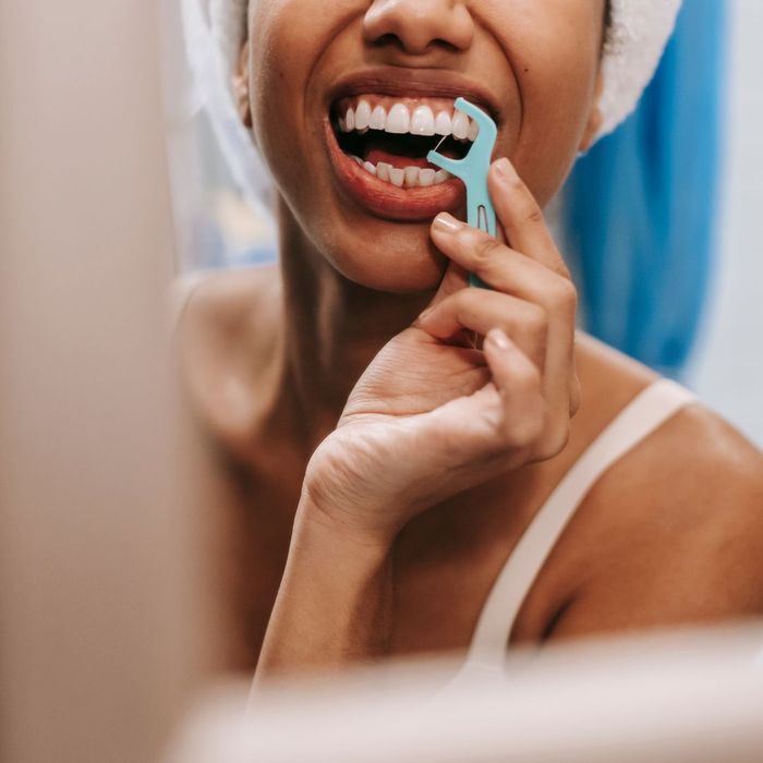 person flossing