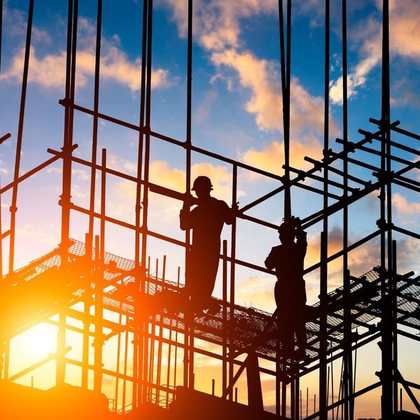 Construction workers up on scaffolding
