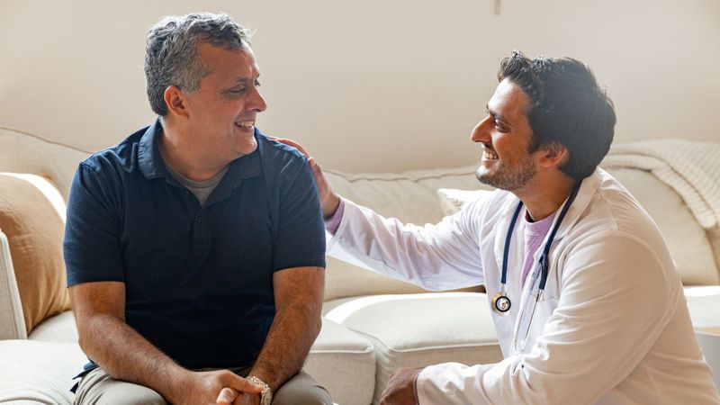 man talking to a doctor