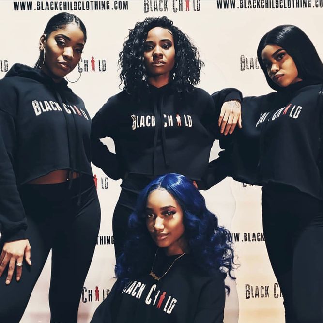 Group of black women wearing hoody
