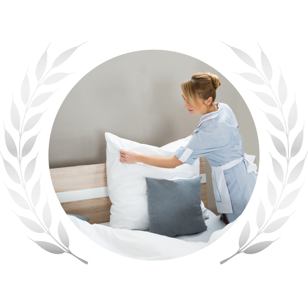 Caregiver making a bed