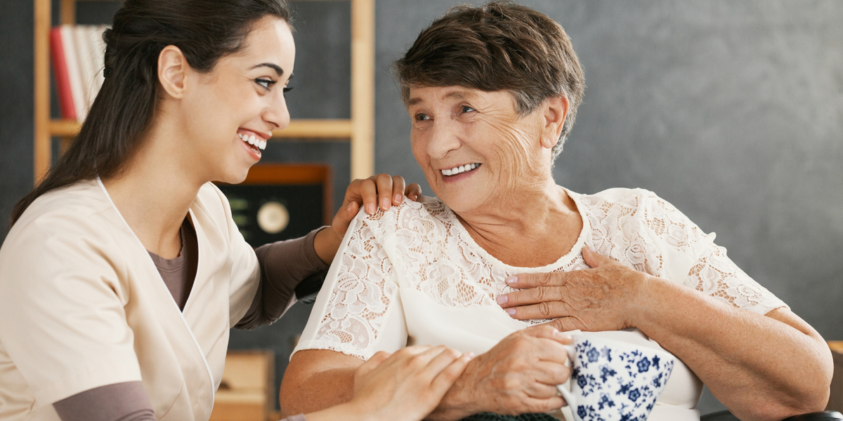 Caregiver talking with senior woman