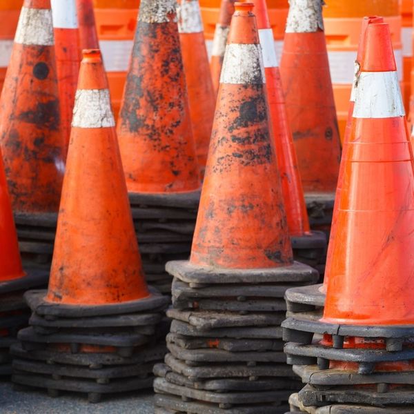 dirty traffic cones stacked 