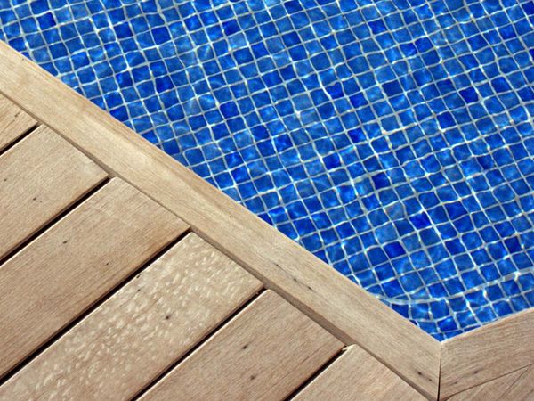 Wood walkway serving as the edge of swimming pool