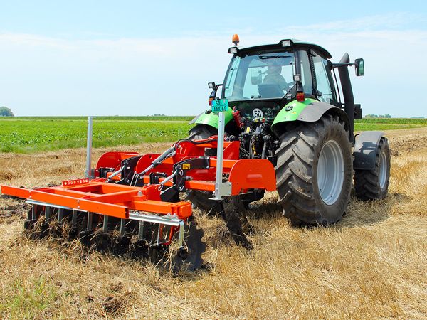 Tractor with a subsoiler working on field