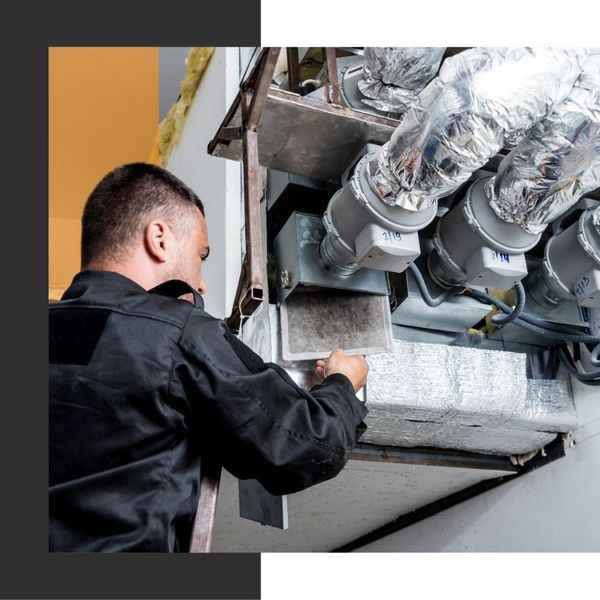 technician working on duct