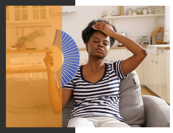 woman fanning herself with a hand fan