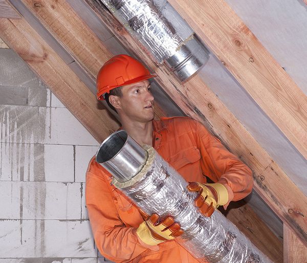 Image of a man installing a duct