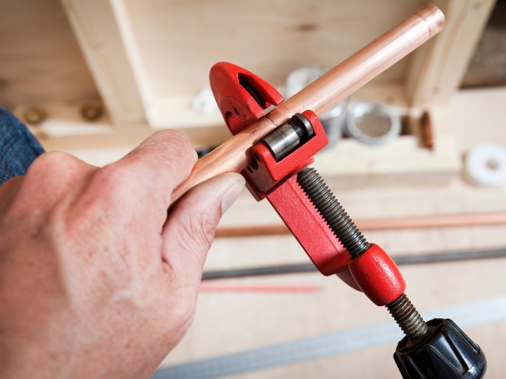 Cutting copper pipe with a tool